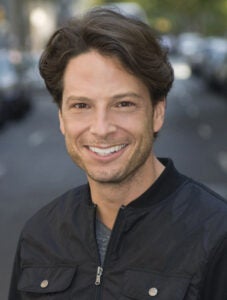 Professional acting headshots: A natural light theatrical headshot taken outdoors.