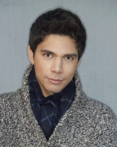 Acting headshots guide: A young male actor showing approachable commercial range and textured sweater wardrobe.