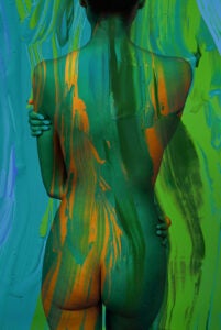Fine art multiple exposure photography featuring a figure against a hand-painted backdrop